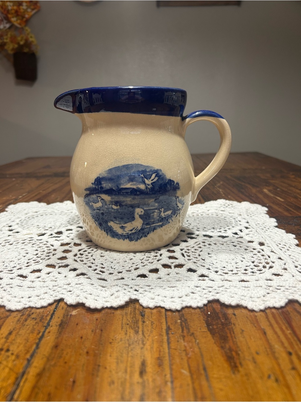 Blue and Cream Ceramic Pitcher with Duck Motif